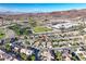 Community aerial shot with nearby park, mountain views, and neatly lined homes at 2309 Tedesca Dr, Henderson, NV 89052