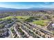 An aerial view of a housing community featuring green landscape and local schools at 2309 Tedesca Dr, Henderson, NV 89052