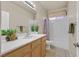 Well-lit bathroom features a single sink vanity, a shower-tub combination, and contemporary fixtures at 2309 Tedesca Dr, Henderson, NV 89052