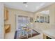 Dining area adjacent to the kitchen featuring a sliding glass door to the backyard and tile floors at 2309 Tedesca Dr, Henderson, NV 89052