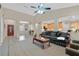 Open concept living space with tile flooring, comfortable seating, and a view into the kitchen at 2309 Tedesca Dr, Henderson, NV 89052