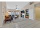 Bright and airy living room with vaulted ceilings, fireplace, and access to backyard views at 2309 Tedesca Dr, Henderson, NV 89052