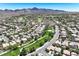Expansive aerial view showcasing a well-planned neighborhood surrounded by natural beauty and recreational areas at 2309 Tedesca Dr, Henderson, NV 89052