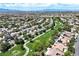 Scenic neighborhood aerial view with well-maintained homes and green spaces under a sunny sky at 2309 Tedesca Dr, Henderson, NV 89052