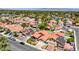 An aerial view showcases a well-maintained residential neighborhood with beautiful homes and mature trees at 2704 Miraflores Ave, Las Vegas, NV 89102