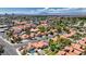Neighborhood featuring well-maintained homes with red tile roofs, lush landscaping, and glimpses of sparkling pools at 2704 Miraflores Ave, Las Vegas, NV 89102