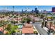 Stunning aerial view capturing the neighborhood, nearby mountains and the iconic Las Vegas Strip skyline at 2704 Miraflores Ave, Las Vegas, NV 89102
