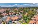An aerial view captures a charming residential neighborhood, with lush landscaping, swimming pools, and well-maintained homes at 2704 Miraflores Ave, Las Vegas, NV 89102