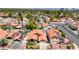 An aerial view showcases a well-maintained residential neighborhood with beautiful homes and mature trees at 2704 Miraflores Ave, Las Vegas, NV 89102