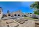 Well-maintained backyard featuring a garden area, shed, and partial patio at 2704 Miraflores Ave, Las Vegas, NV 89102