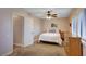 Comfortable bedroom featuring a ceiling fan, natural light, and neutral tones at 2704 Miraflores Ave, Las Vegas, NV 89102
