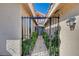 Wrought-iron front gate leading up to the front door provides security and enhances the property's curb appeal at 2704 Miraflores Ave, Las Vegas, NV 89102