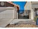 View of the garage and wrought iron gate showing the property's exterior features and design elements at 2704 Miraflores Ave, Las Vegas, NV 89102