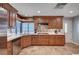 Well-lit kitchen featuring custom cabinets, stone backsplash, and modern stainless steel appliances at 2704 Miraflores Ave, Las Vegas, NV 89102