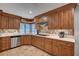 Well-appointed kitchen featuring custom cabinets, stone backsplash, and modern appliances at 2704 Miraflores Ave, Las Vegas, NV 89102
