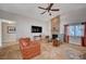 Comfortable living room with tile flooring, stone fireplace, and neutral paint palette creates a warm and inviting atmosphere at 2704 Miraflores Ave, Las Vegas, NV 89102