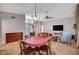 Spacious living room area featuring a stone fireplace and a cozy seating arrangement at 2704 Miraflores Ave, Las Vegas, NV 89102