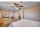 Bright bedroom featuring a ceiling fan, carpet flooring and a mirrored sliding closet at 2704 Miraflores Ave, Las Vegas, NV 89102
