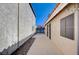 View of the side yard showcasing walkway and gate at 2704 Miraflores Ave, Las Vegas, NV 89102