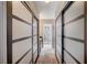 Walk-in closet featuring sliding doors, tile flooring, and access to the bathroom at 2704 Miraflores Ave, Las Vegas, NV 89102