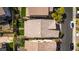 An aerial view displays a well-maintained backyard with lush landscaping, seamlessly blending comfort and sophistication at 28 Verde Rosa Dr, Henderson, NV 89011