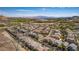 Beautiful aerial view of a suburban neighborhood with mountain views in the distance on a sunny day at 28 Verde Rosa Dr, Henderson, NV 89011