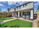 Spacious backyard with artificial turf, covered patio area with ample seating, perfect for entertaining at 28 Verde Rosa Dr, Henderson, NV 89011