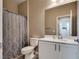 Bathroom with a shower, toilet, and vanity with ample counter space at 28 Verde Rosa Dr, Henderson, NV 89011