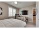 Bedroom with two beds, ceiling fan, and neutral decor at 28 Verde Rosa Dr, Henderson, NV 89011