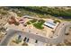 Aerial view of community park complete with picnic shelters, a playground, and walking path at 28 Verde Rosa Dr, Henderson, NV 89011