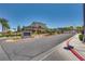 View of the neighborhood entrance sign, lush landscaping, and upscale homes in the background, offering a secure, gated community at 28 Verde Rosa Dr, Henderson, NV 89011