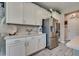 Modern kitchen with stainless steel appliances, white cabinetry, and sleek countertops at 28 Verde Rosa Dr, Henderson, NV 89011