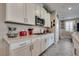 Modern kitchen with white cabinets, stainless steel appliances, and stylish countertops, with good lighting at 28 Verde Rosa Dr, Henderson, NV 89011