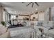 Open concept living space showcasing a seamless transition to a dining area with a well-equipped kitchen at 28 Verde Rosa Dr, Henderson, NV 89011