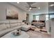 Loft area featuring a comfortable white sofa and a patterned rug on carpet at 28 Verde Rosa Dr, Henderson, NV 89011