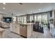 Open-concept kitchen, dining, and living area with bright, natural light and stylish furnishings at 28 Verde Rosa Dr, Henderson, NV 89011
