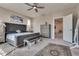 A serene main bedroom showcases a ceiling fan, stylish decor and furniture, and plush carpeting at 28 Verde Rosa Dr, Henderson, NV 89011