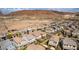 An aerial view of a well-planned community is surrounded by desert landscape, providing a peaceful living environment at 28 Verde Rosa Dr, Henderson, NV 89011
