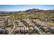 A scenic neighborhood features a tranquil lake and recreational green spaces, offering a serene and active lifestyle at 28 Verde Rosa Dr, Henderson, NV 89011