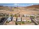 An aerial view of a vibrant suburban community nestled against a backdrop of picturesque mountains, with easy access to recreation at 28 Verde Rosa Dr, Henderson, NV 89011