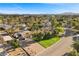 A beautiful aerial view shows this home's landscaping, palm trees, and nearby mountain view at 2885 Horseshoe Dr, Las Vegas, NV 89120