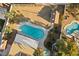 An aerial view of this home's in-ground pools, backyard shed, and desert landscaping at 2885 Horseshoe Dr, Las Vegas, NV 89120