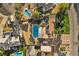 Expansive aerial view of property featuring a pool, solar panels, and lush landscaping at 2885 Horseshoe Dr, Las Vegas, NV 89120