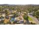 An aerial view shows the home, backyard pool, landscaping, nearby houses, and surrounding areas at 2885 Horseshoe Dr, Las Vegas, NV 89120