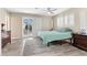 Relaxing bedroom features soft natural light with shuttered windows and a glass door at 2885 Horseshoe Dr, Las Vegas, NV 89120