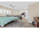 Comfortable bedroom features soft natural light with shuttered windows and a ceiling fan at 2885 Horseshoe Dr, Las Vegas, NV 89120