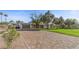 Paver driveway leading to a charming home with lush landscaping and mature trees at 2885 Horseshoe Dr, Las Vegas, NV 89120