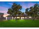Charming single-story home with a manicured lawn and mature olive trees providing ample shade at 2885 Horseshoe Dr, Las Vegas, NV 89120