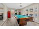 Bright game room featuring a pool table and easy access to the outdoor spaces at 2885 Horseshoe Dr, Las Vegas, NV 89120