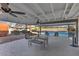 Covered patio with a dining set, grill, ceiling fans, and access to pool, great for outdoor gatherings and relaxation at 2885 Horseshoe Dr, Las Vegas, NV 89120